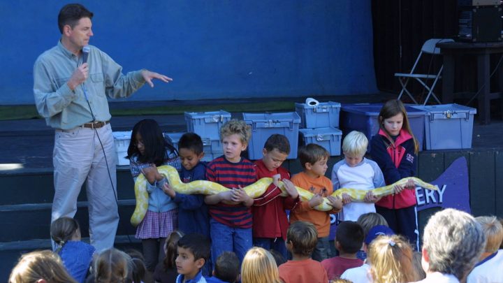 Kids holding snake